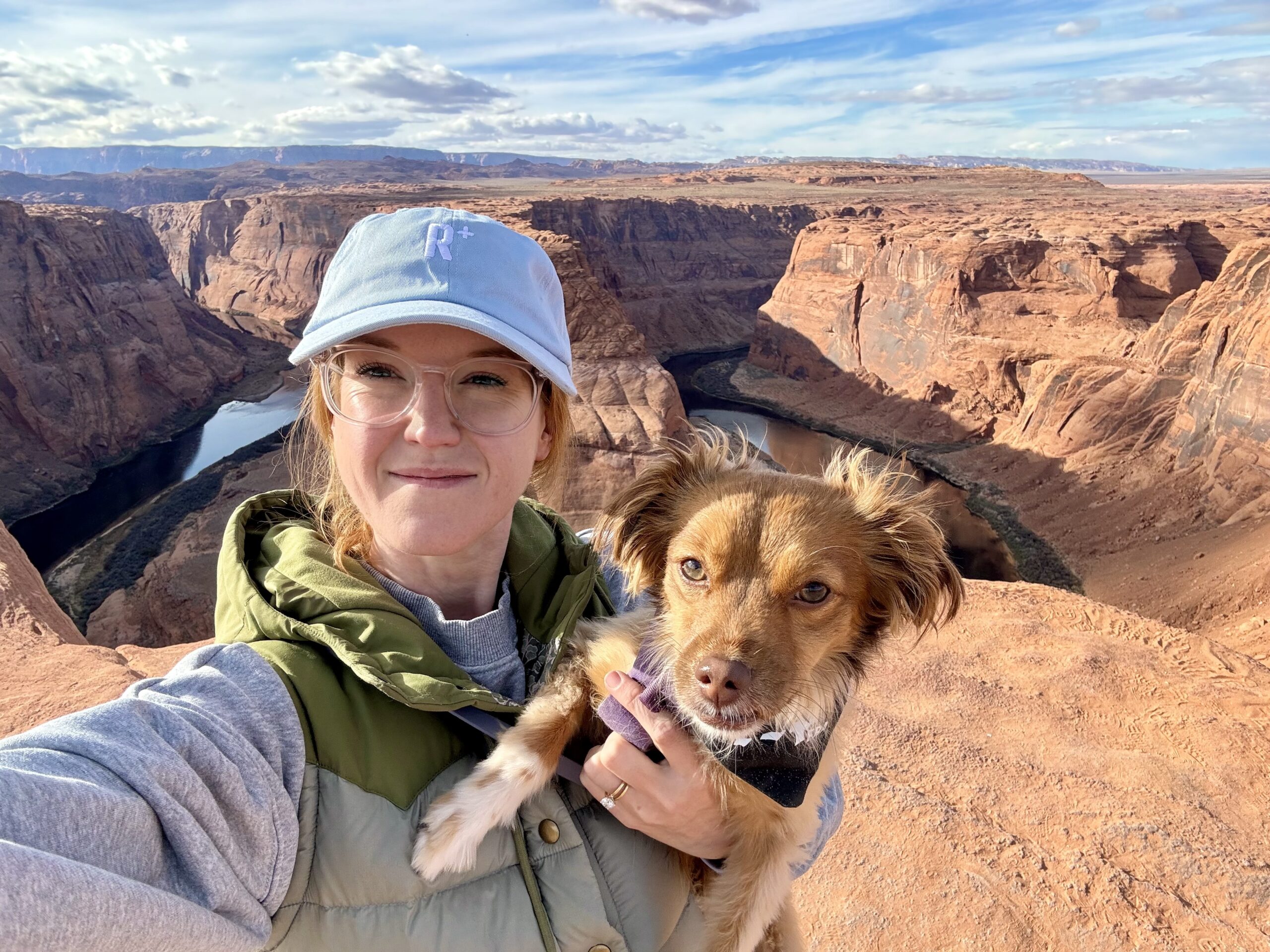 Bree holding Veronica above a river canyon