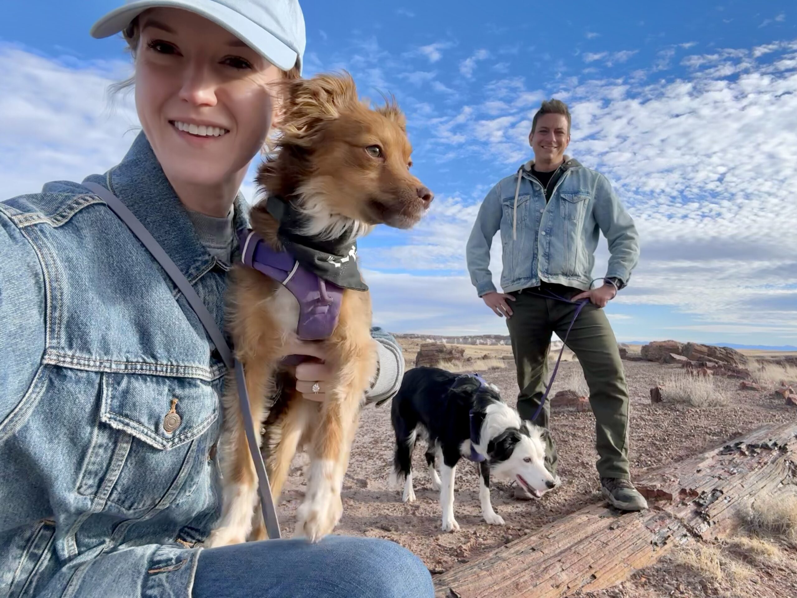 Bree holding Veronica, with Zak and Inertia beside them overlooking a canyon.
